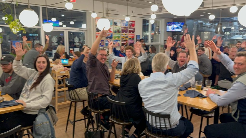 A Case Study: How High Grain Brewing Co. Proved Trivia’s Cross-Demographic Appeal 1 A full taproom at High Grain Brewing in Cincinnati during a high-energy trivia night with guests raising their hands in excitement